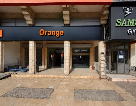 Orange Jordan retail storefront mid-retrofit, exterior finishing by Murano